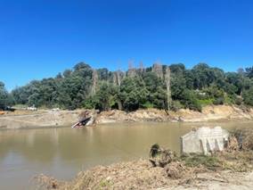 A river with trees and a blue sky

AI-generated content may be incorrect.