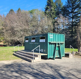 A green container with stairs and steps
AI-generated content may be incorrect.